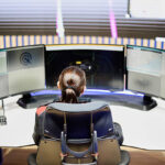 Security analyst monitoring Next-Generation Firewall network traffic at a cybersecurity operations center